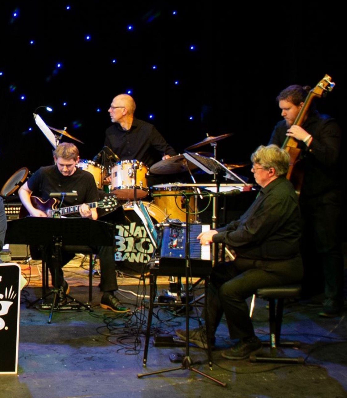 Band performance with drums and brass